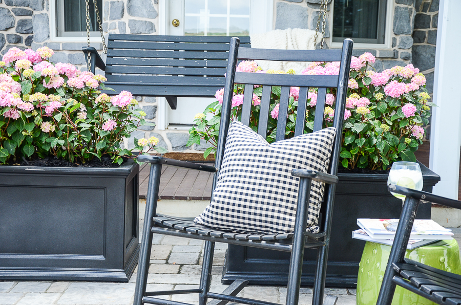 hydrangeas in planters on the porch