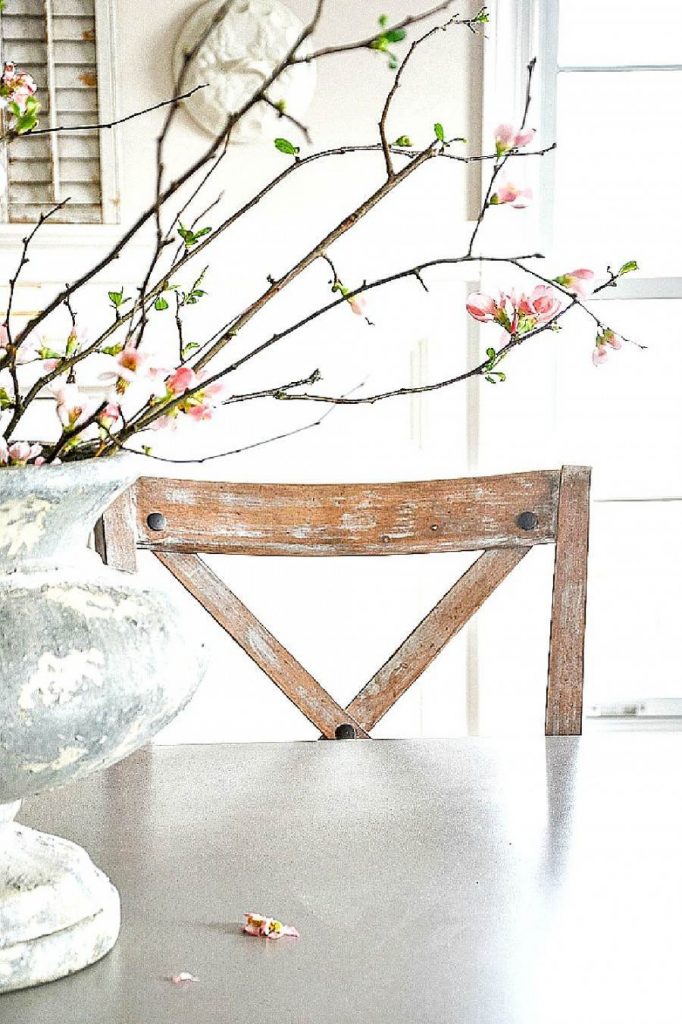 BEAUTIFUL FLOWERING QUINCE BRANCHES ON A TABLE