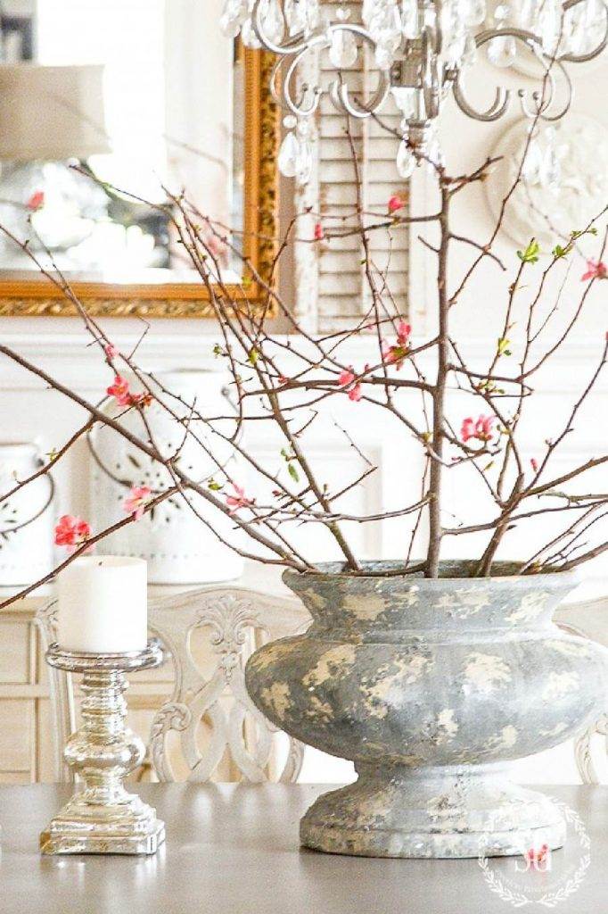 FLOWERING BRANCHES IN A BIG URN