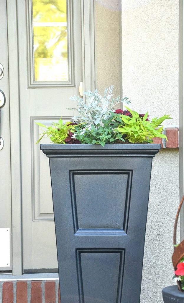 TALL BLACK PLANTER WITH ANNUALS