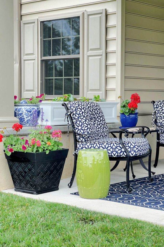 FLOWERS ON A PATIO IN BIG POST AND PLANTERS