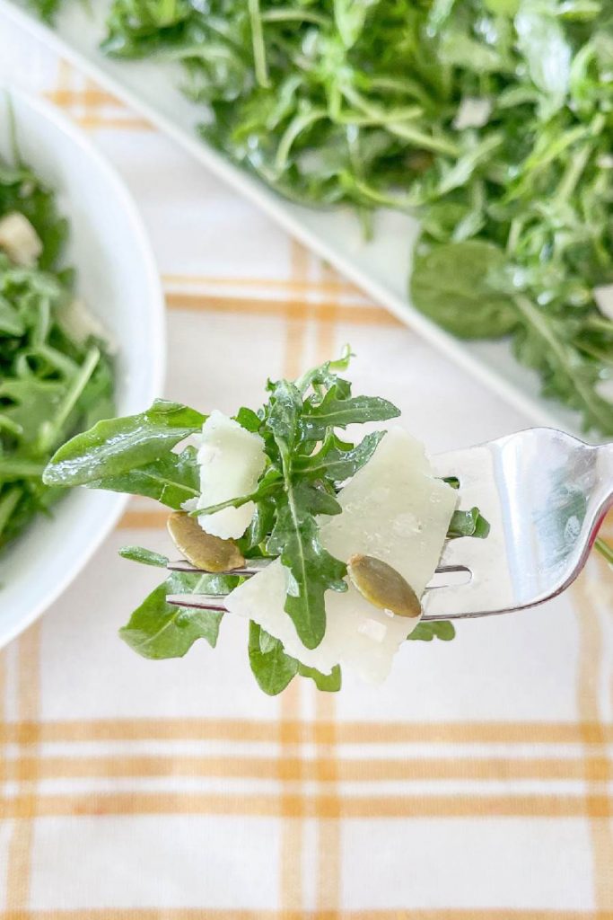 a bite of salad on a fork