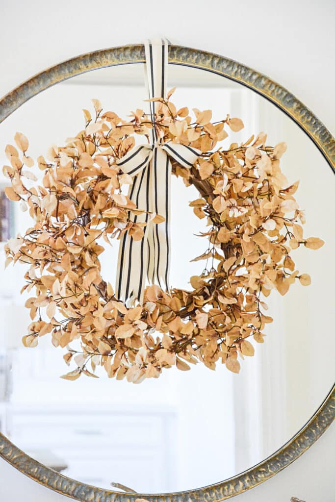 2023 FALL HOME TOUR- honey colored wreath hanging on a mirror