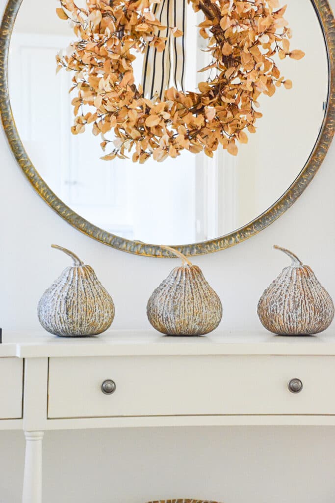 2023 FALL TOUR- trio of faux gourds on the console in the foyer