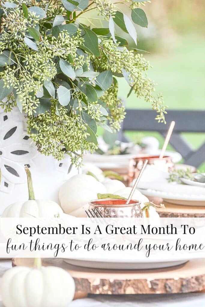 outdoor table set with hydrangeas and pumpkins