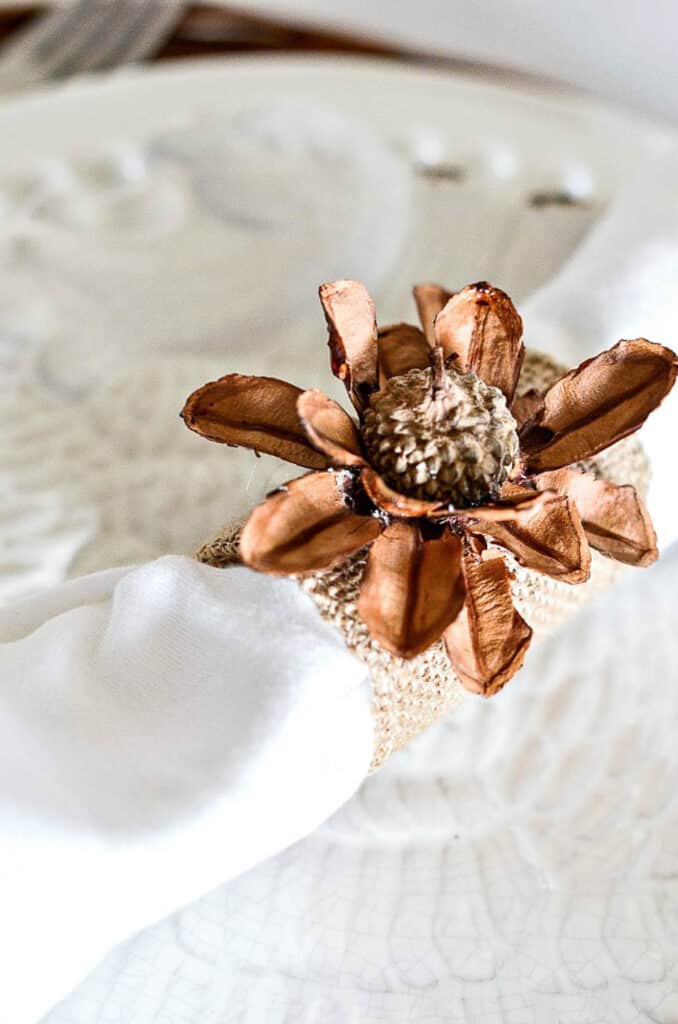 ACORN + PINECONE NAPKIN RING- diy napkin ring with a white napkin in it