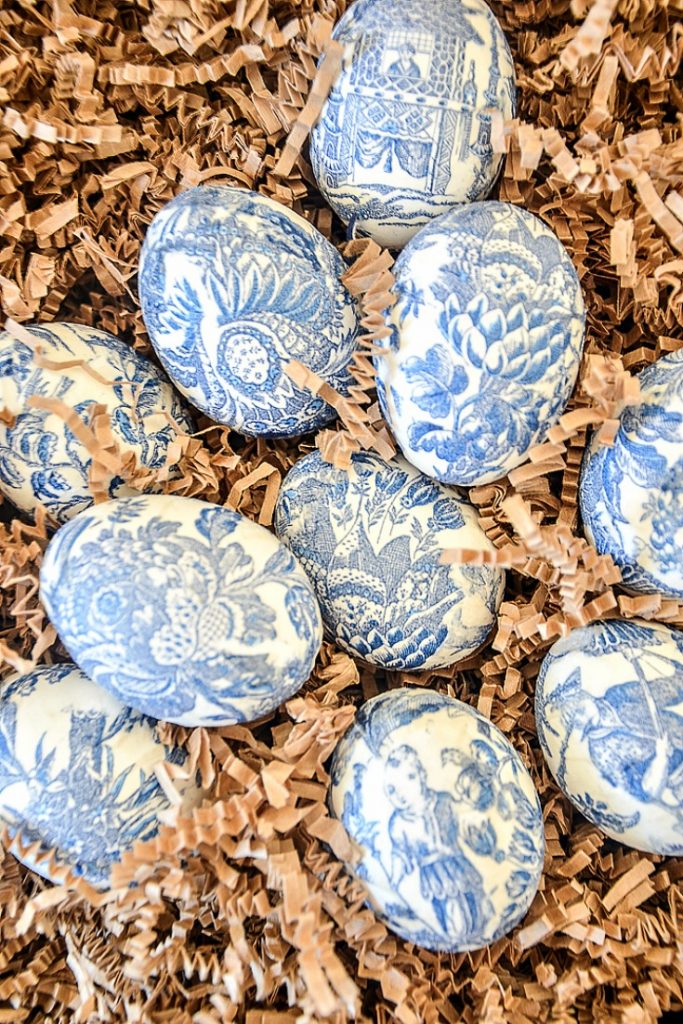 Chinoiserie Easter Eggs on a bed of brown crinkle paper