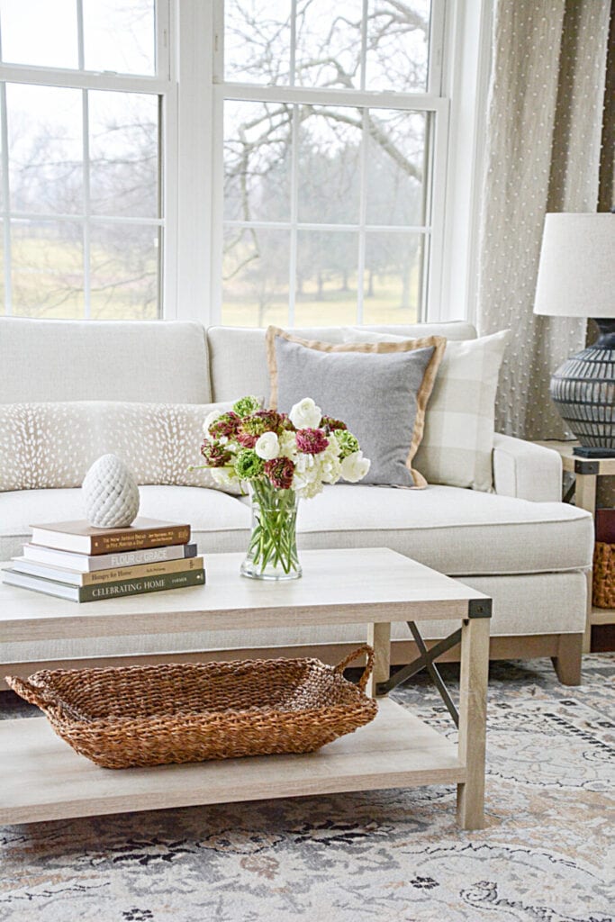 COFFEE TABLE AND VASE OF FLOWERS