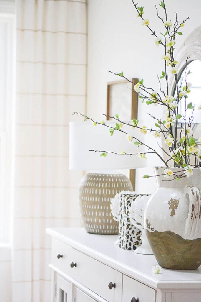 DECORATING WITH BOOKS-books on a buffet with bookends