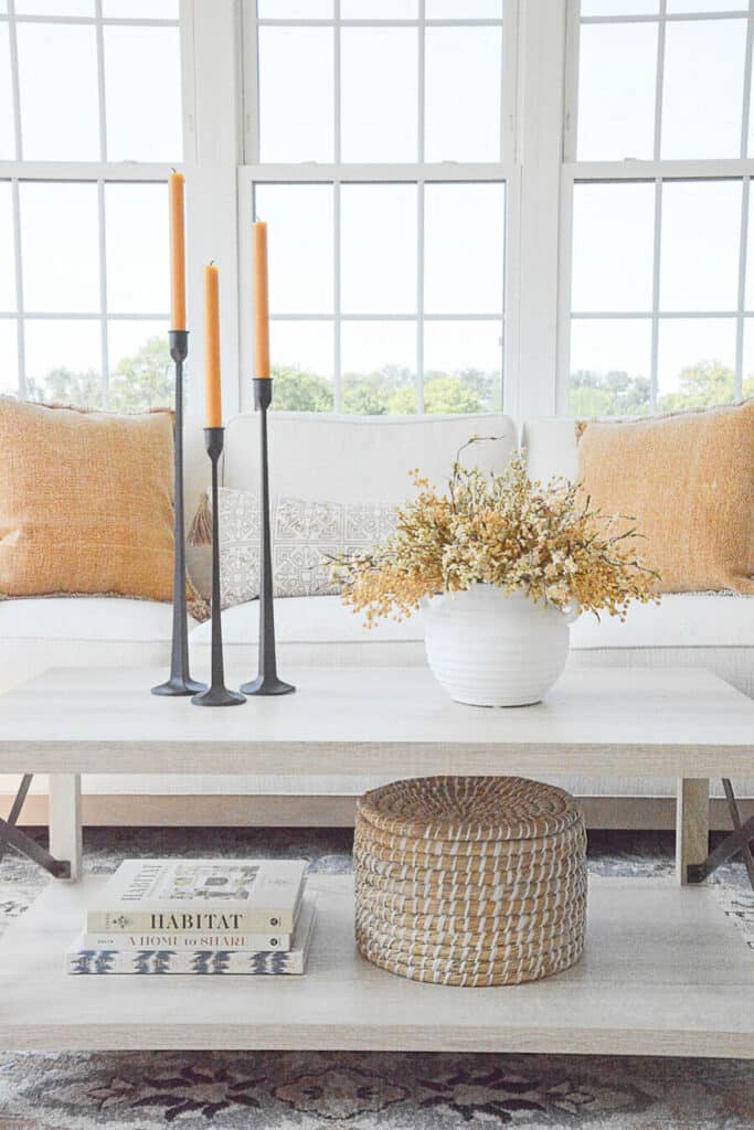 FALL ARRANGEMENT ON A COFFEE TABLE WITH CANDLES