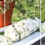 LOG OF CUT HERB BUTTER ON A WHITE PLATE