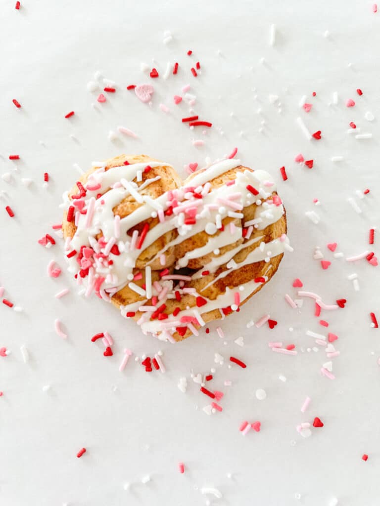 heart shaped cinnamon rolls with sprinkles