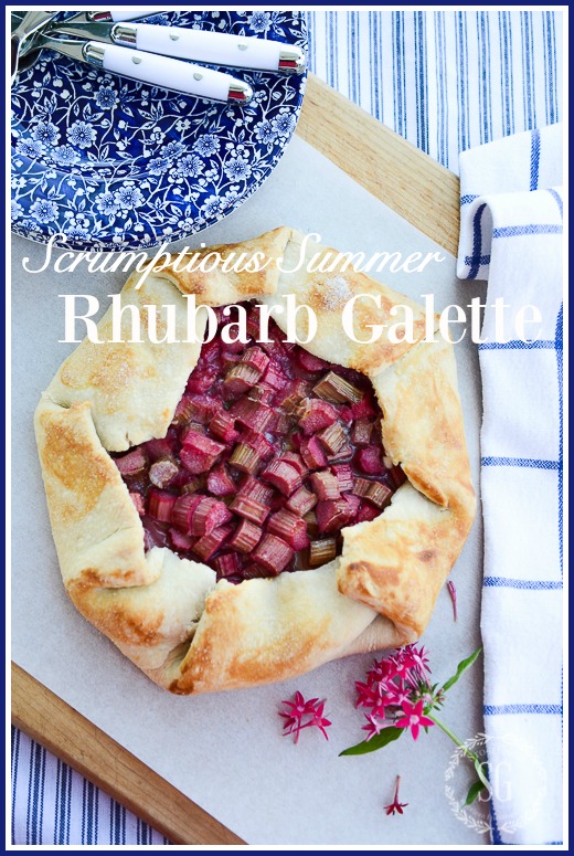 RHUBARB GALETTE ON A WORK SURFACE WITH BLUE AND WHITE PLATES