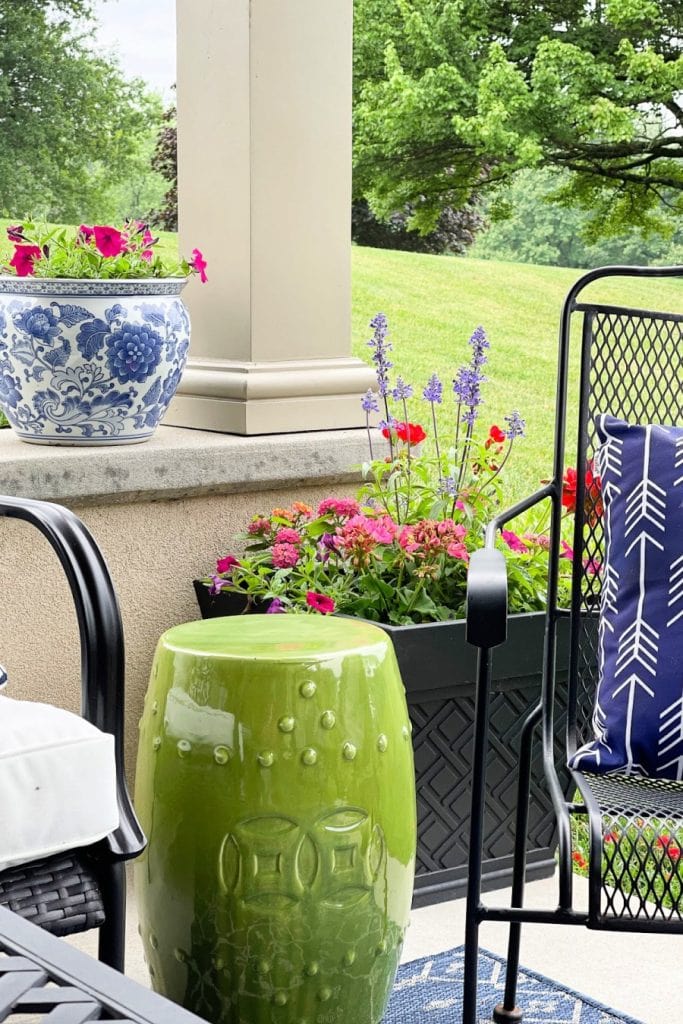 porch with containers of flowers