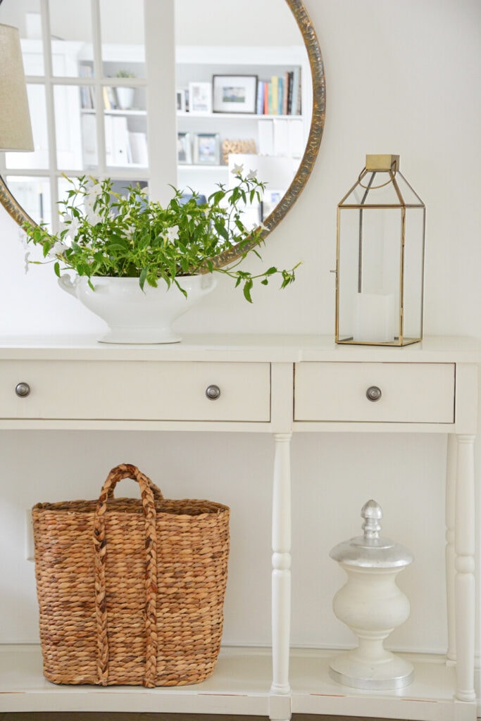 FOYER WITH CONSOLE TABLE AND A MIRROR