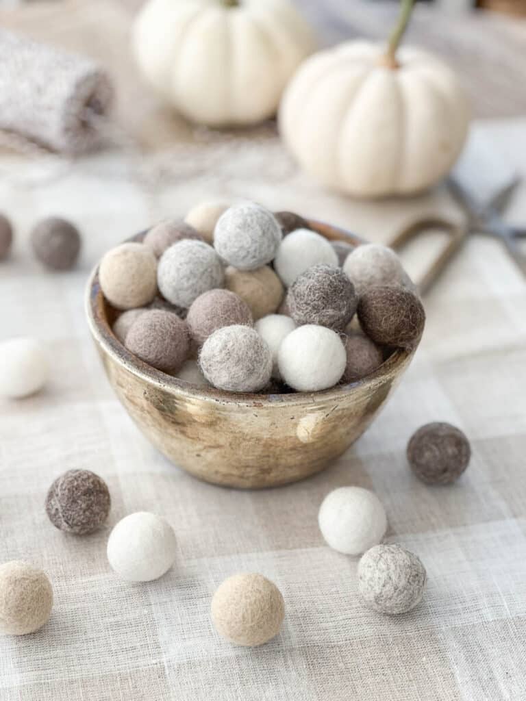 WOOL BALLS IN A GOLD BOWL